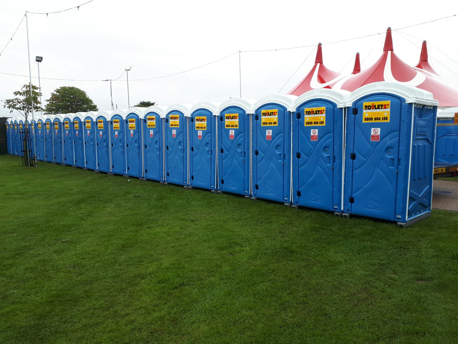 Standard toilets lined up at event